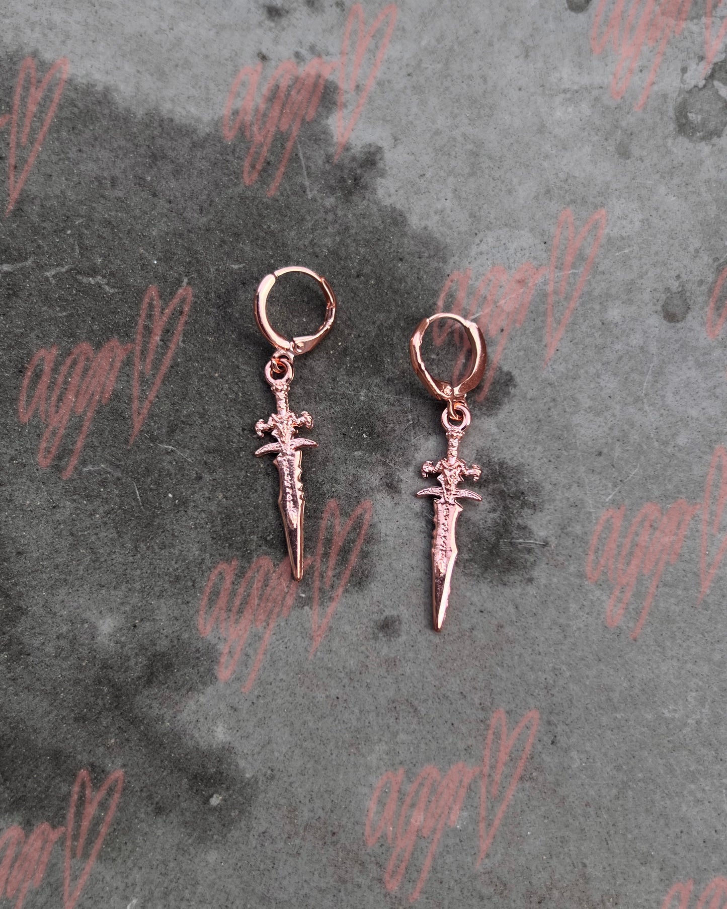 your dagger vs. my heart earrings