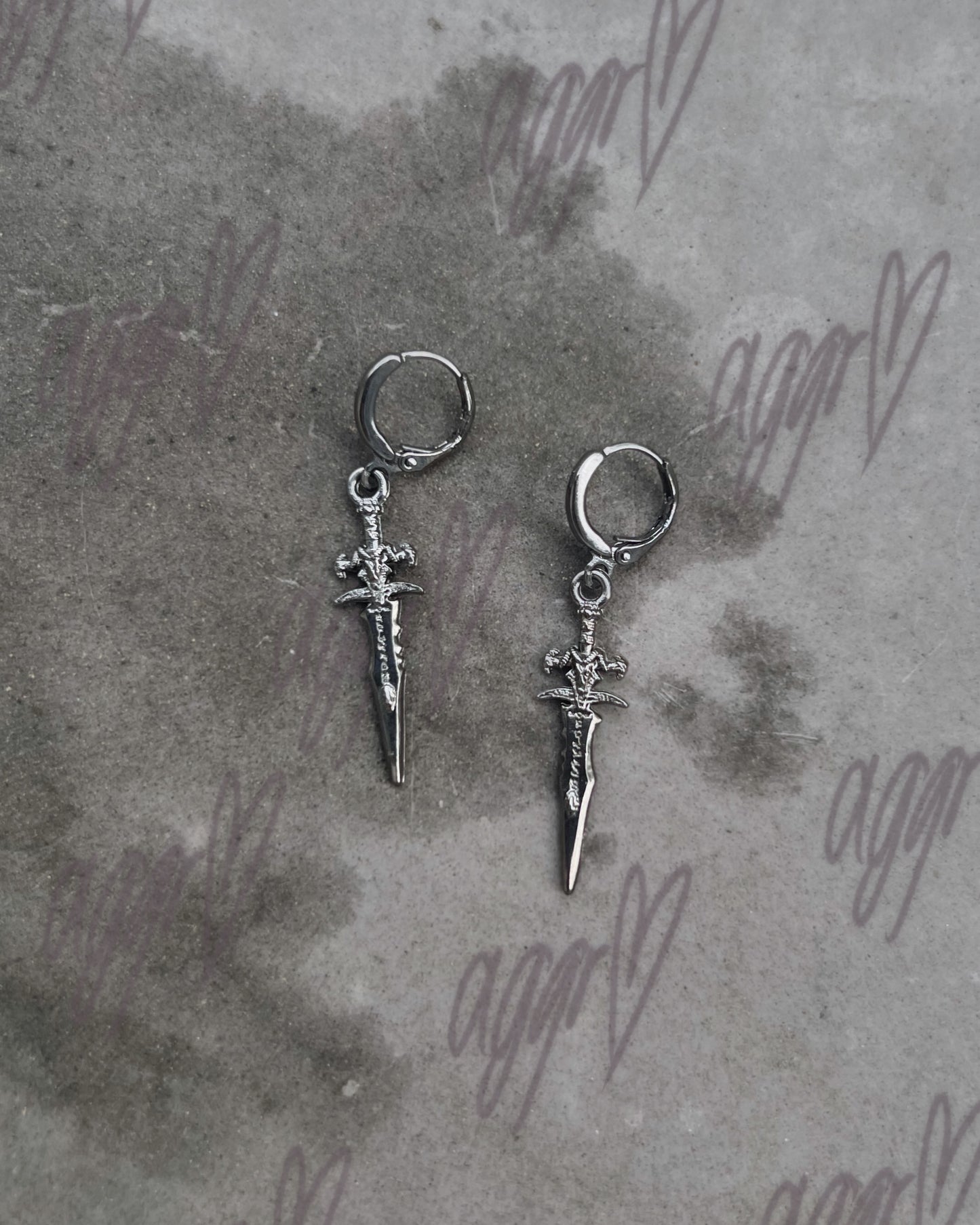 your dagger vs. my heart earrings