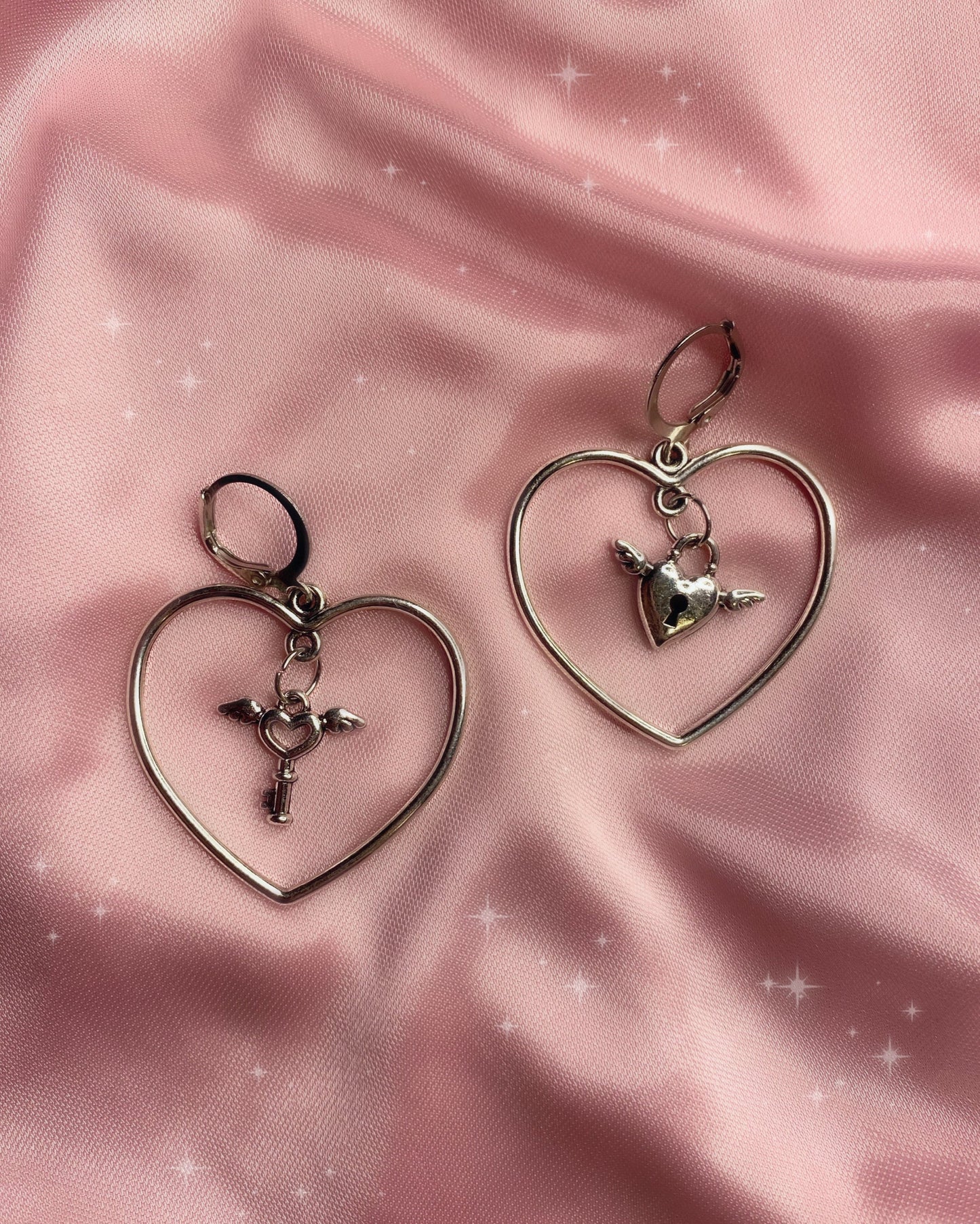 locked up angel heart drop earrings